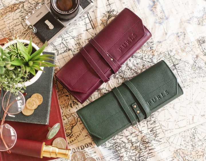 Venture & Tempest: A Furls Crochet Giveaway! This is a picture of two of the Leather Hook Rolls - one Plum and one a green color