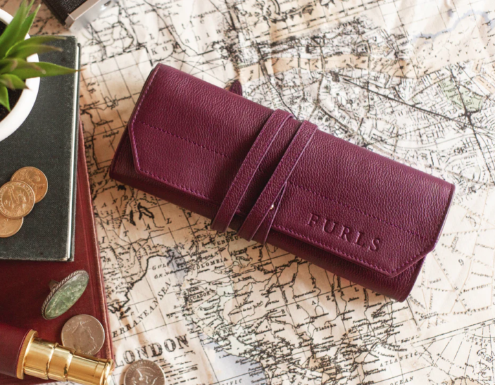 Venture & Tempest: A Furls Crochet Giveaway! This is an image of a Plum colored leather pouch designed to hold hooks.